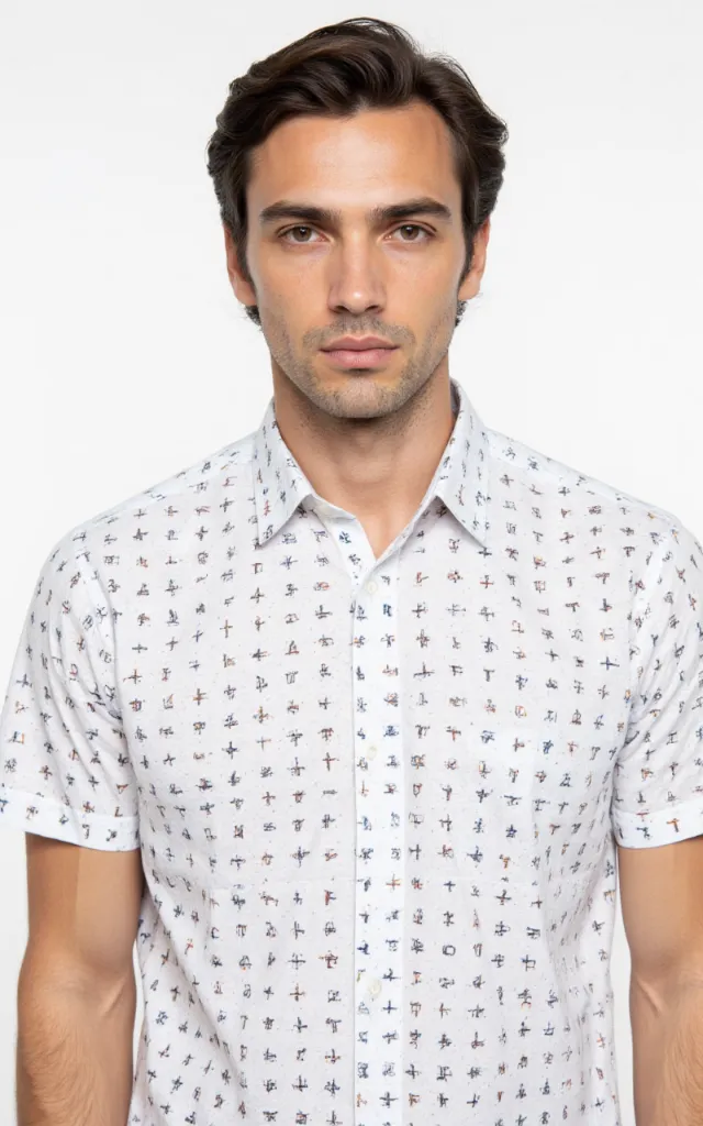 A French model wearing a Cross   hatch pattern   printed shirt, against a white background, in a front   facing bust portrait